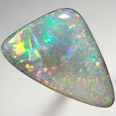 SOLID SEMI BLACK OPAL Very unual opal with an exploding rainbow. SEE VIDEO  
